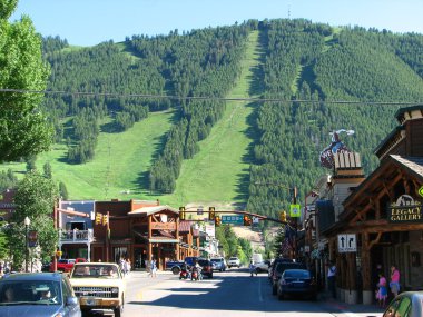 JACKSON HOLE, WYOMING - JUN 29: View of the main street with peo clipart