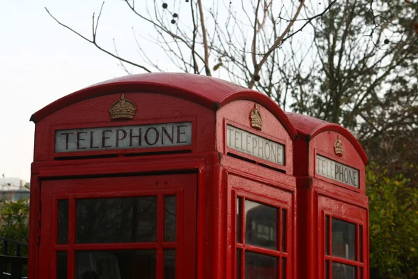 Two classic red London Telephone boxes, in the City of London, E