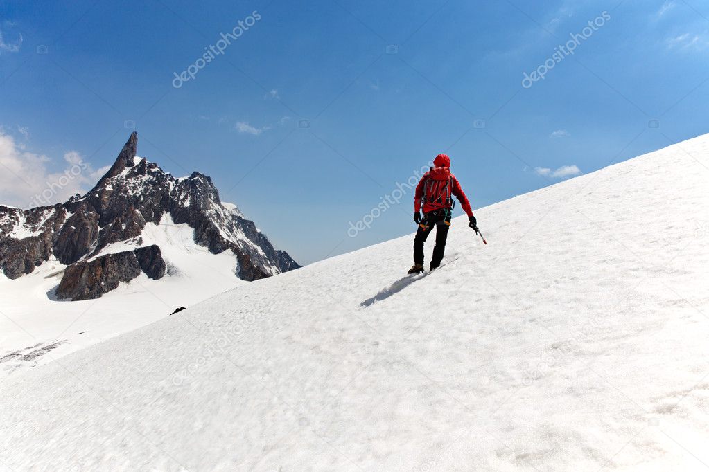 A mountaineer on the way for reach the summit