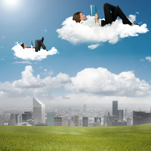 Business reading book in the sky — Stock Photo, Image