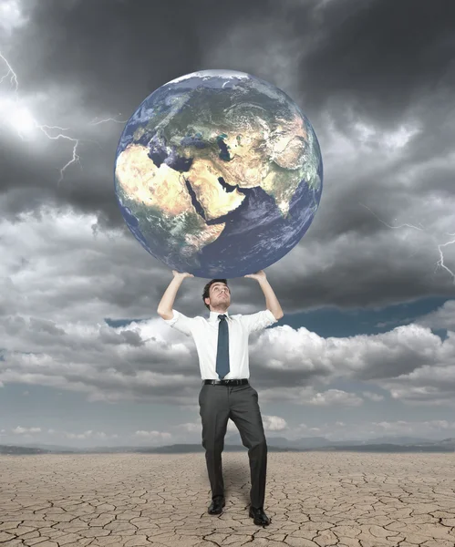 Businessman protects the world — Stock Photo, Image