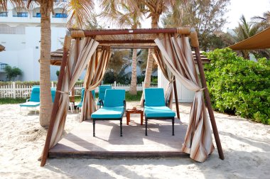 Hut on the beach of luxury hotel, Ajman, UAE clipart