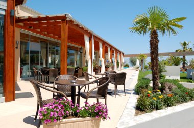 Sea view outdoor restaurant at the modern luxury hotel, Pieria, clipart