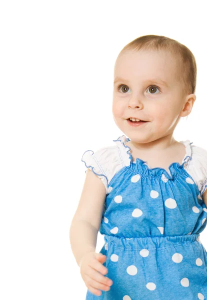 Маленька дівчинка в блакитній сукні посміхається — стокове фото