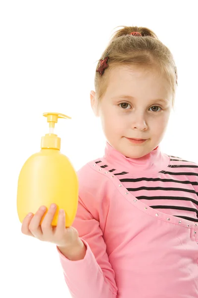 The girl is holding a plastic bottle — Stock Photo, Image