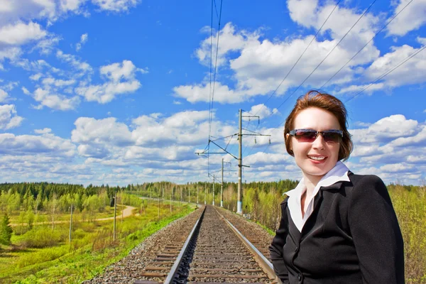Young business woman on the railway. — Stock Photo, Image