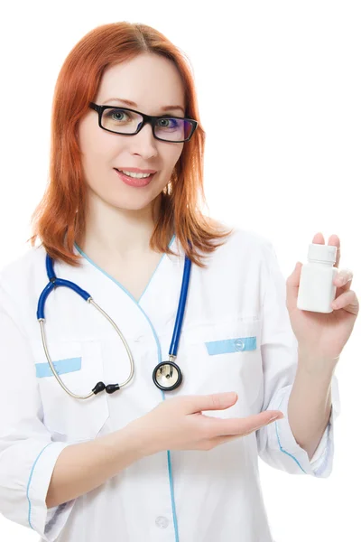 De vrouw van de arts met een container van vitaminen — Stockfoto