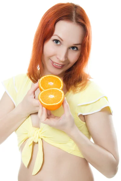 Young woman with oranges — Stock Photo, Image