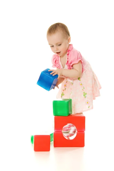 Baby playing with colourful blocks Stock Photo