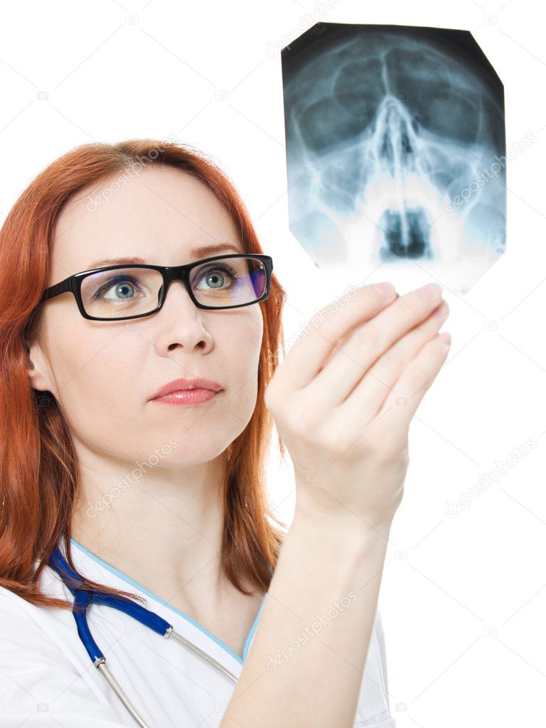 Female doctor examining X-ray image on a white background.