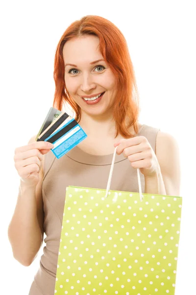 Vrouw met creditcards en shopping. — Stockfoto