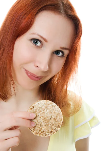 Woman eating cookies on white background. — Stock Photo, Image