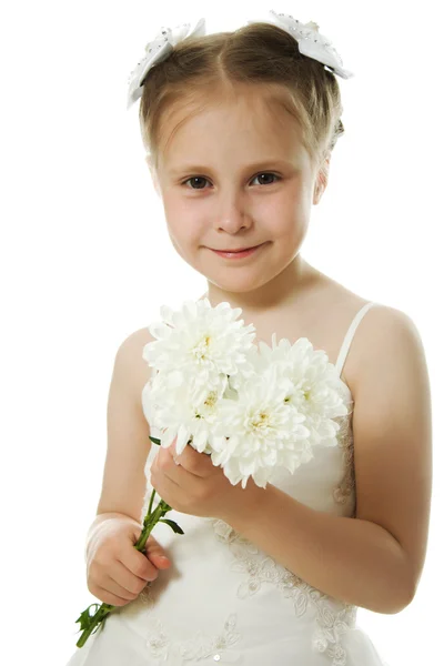 Beautiful girl in white dress with a flower — Stock Photo, Image
