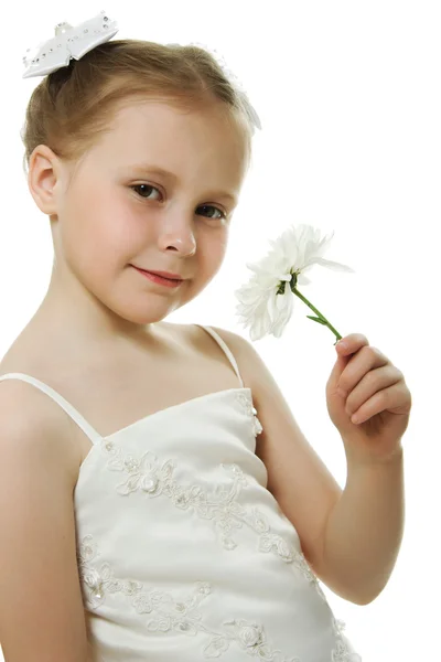 stock image Beautiful girl in white dress with a flower