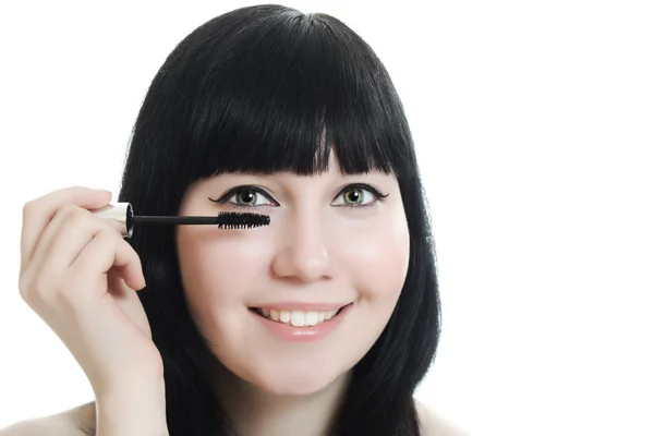 Young woman directs a make-up eyelash — Stock Photo, Image