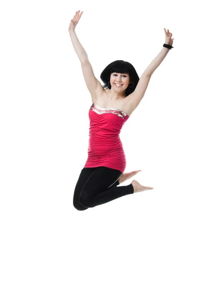 Mladá žena skákat vysoko do vzduchu — Stock fotografie