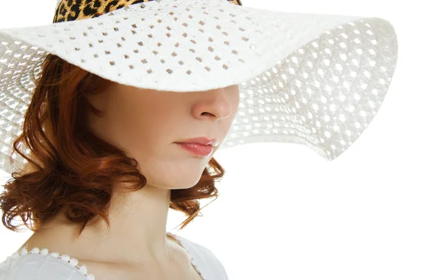 Girl in the white hat hiding his eyes — Stock Photo, Image
