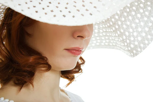 Girl in the white hat hiding his eyes — Stock Photo, Image
