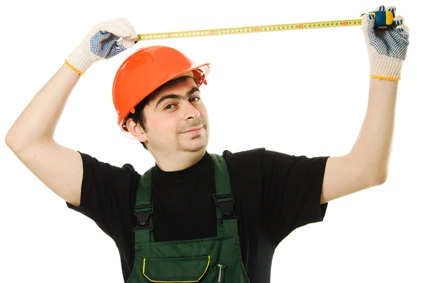 The builder measures the length of the tape measure — Stock Photo, Image