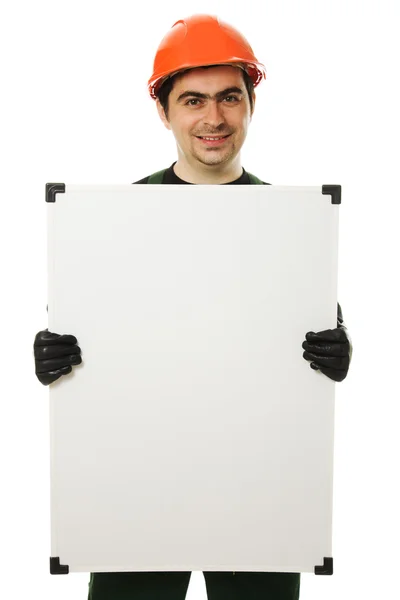 Construtor sênior segurando a placa em branco — Fotografia de Stock