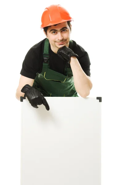 Construtor sênior segurando a placa em branco — Fotografia de Stock