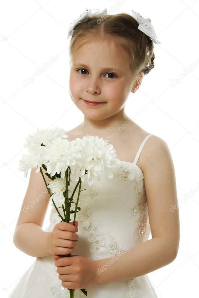 Beautiful girl in white dress with a flower