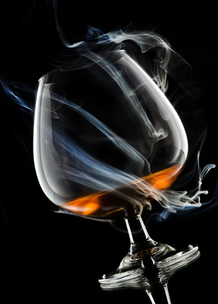 Cognac in smoke — Stock Photo, Image