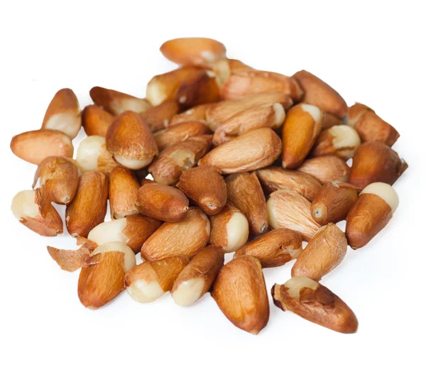Pine nuts on the white — Stock Photo, Image