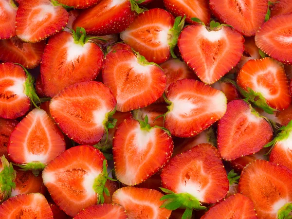 Frisch geschnittene Erdbeeren Hintergrund — Stockfoto