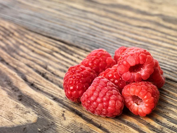 Raspberry on wood background selective focus — Stock Photo, Image