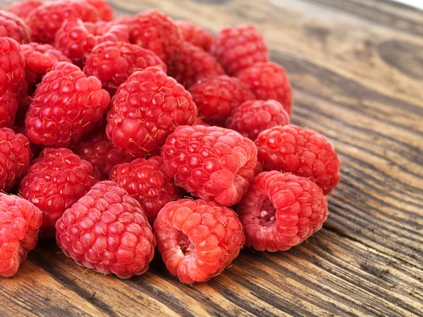 Raspberry on wood background selective focus — Stock Photo, Image