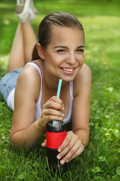 Beautiful young drinking girl — Stock Photo, Image