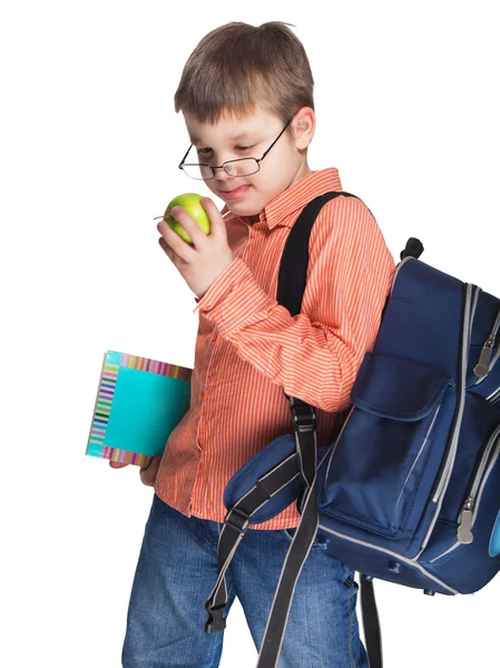 Schoolchild dalam gelas dengan apel — Stok Foto