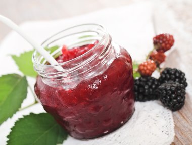 Blackberry jam and fresh blackberries clipart