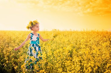 Smile girl in rape field clipart