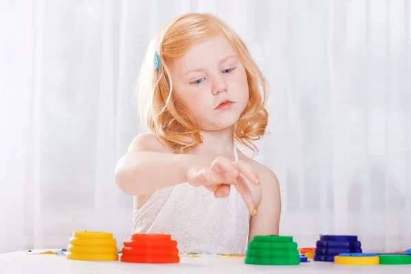Girl with colorful paints ready for hand prints — Stock Photo, Image