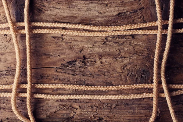 stock image Rope on a wooden background