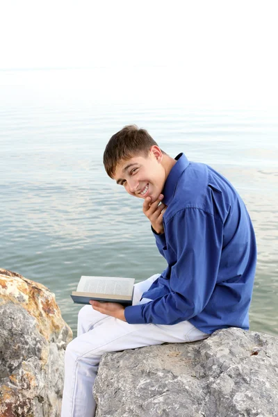 Happy teenager with book — Stock Photo, Image