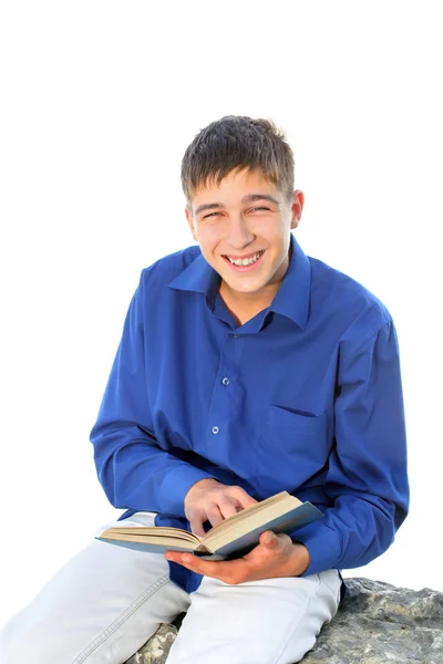 Adolescent heureux avec livre — Photo