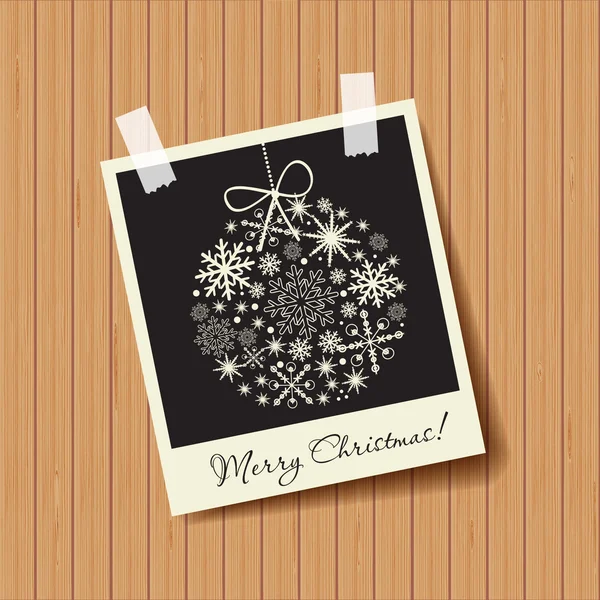 Photo frame with snowflakes ball on wooden background. Christmas concept — Stock Vector