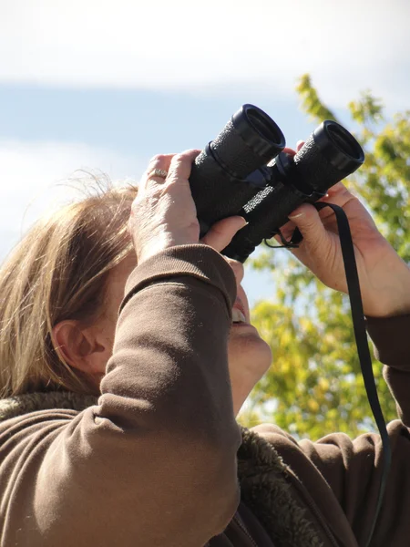 Stock image Female with binoculars.