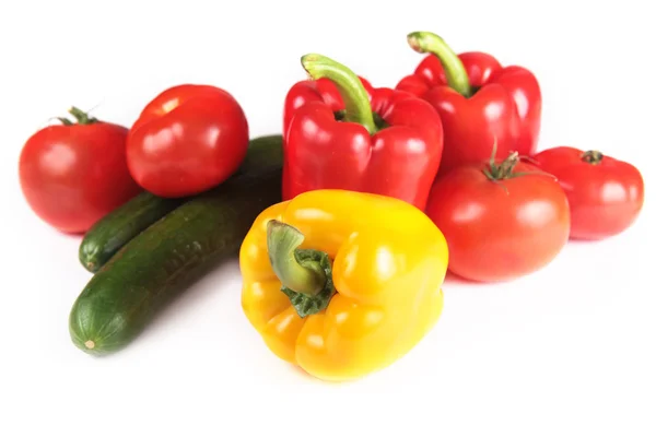 stock image Fresh yellow and red paprika, tomatoes and cucumbers isolated on white background