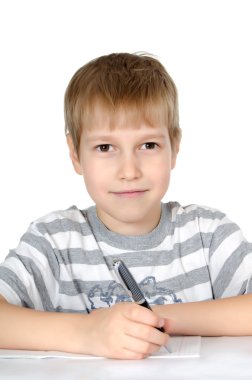 The little boy writes to writing-books a ball pen clipart