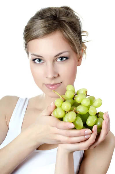 Het mooie meisje met groene druiven — Stockfoto