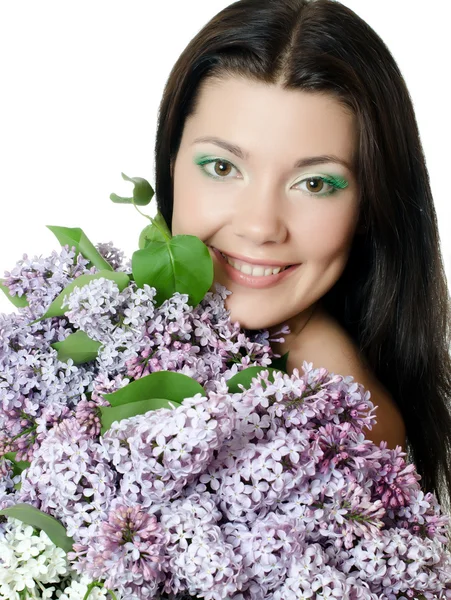 Hermosa mujer con flores de primavera de una lila. Cáscara — Foto de Stock