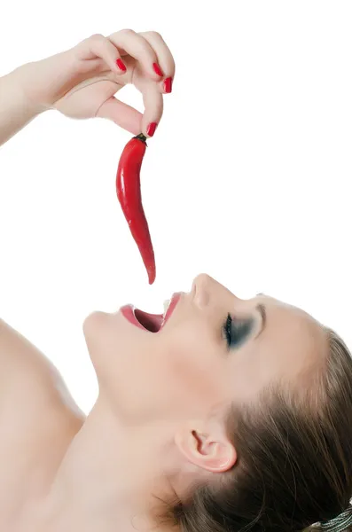 stock image The beautiful girl with pepper chili