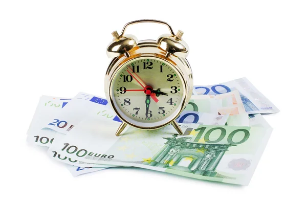 Relógio despertador para notas de euro isoladas sobre fundo branco — Fotografia de Stock