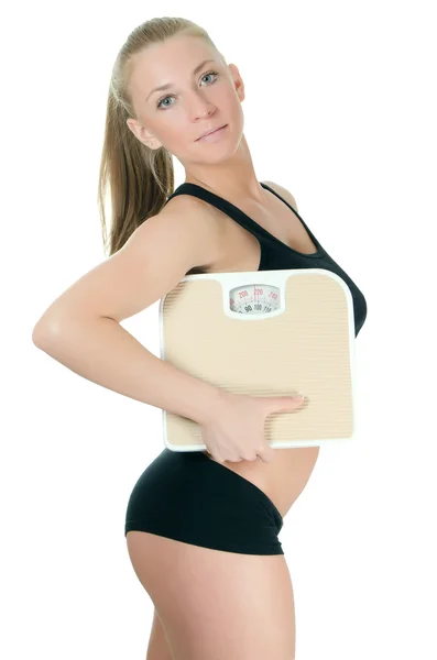 Sportovní holka s váhy izolované na bílém pozadí — Stock fotografie