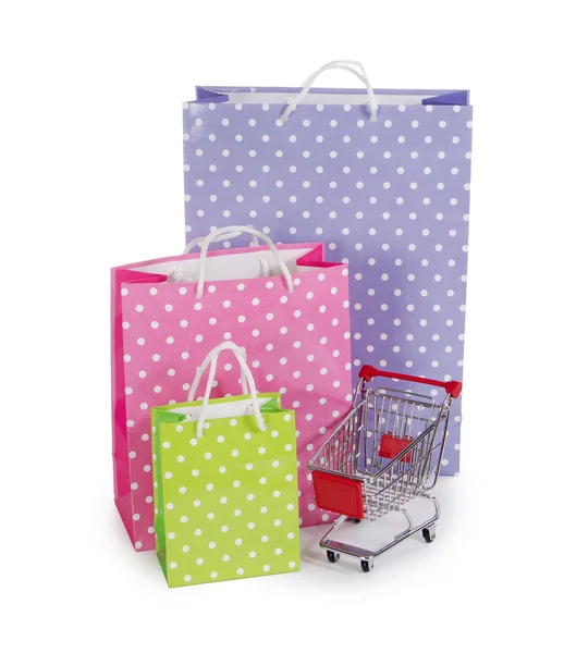 The shopping cart and bags isolated on white — Stock Photo, Image