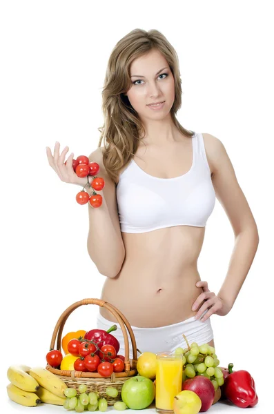 Vacker flicka med frukt och grönsaker — Stockfoto